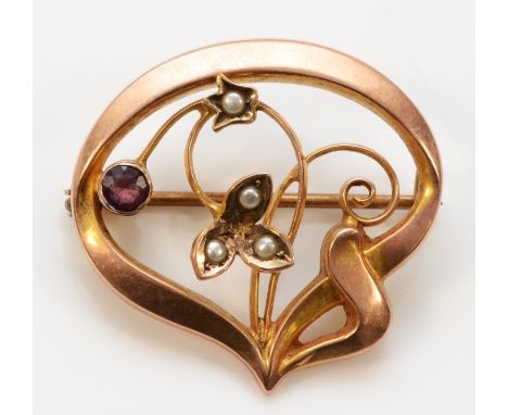 A 9ct gold Art Nouveau amethyst paste and seed pearl brooch, 25mm across, 1.6g