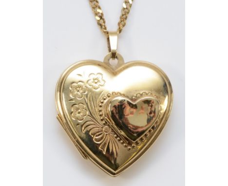 A 9ct gold heart shaped locket with chain, floral engraving to the front of the locket, 25mm heart length, 7.3g