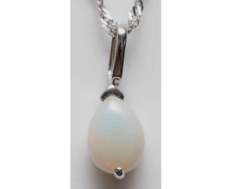 A 9ct white gold opal pendant with a chain, 1.6g