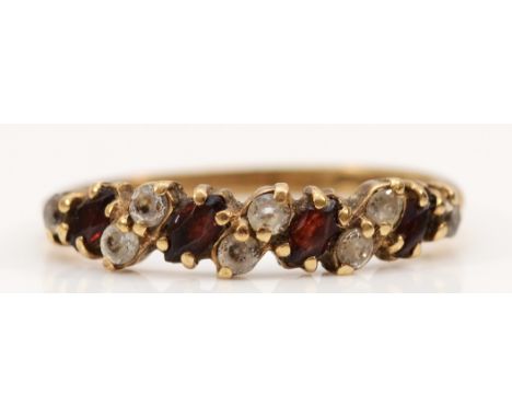 A 9ct gold garnet and white gemstone half eternity ring, N, 1.5g