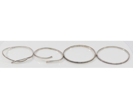 Two 925 silver and diamond set bangles, a sapphire set bangle and a pink stone bangle, 46gm (4)