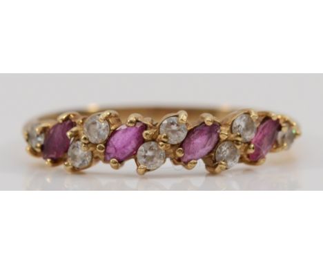 A 9ct gold ruby and cubic zirconia half eternity ring, P 1/2, 1.6g