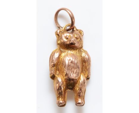 A 9ct gold charm in the form of a bear, 15mm in length, 0.3g