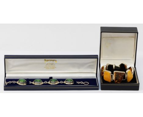 A 925 silver cased amber bracelet, 55mm interior diameter, together with another silver cased version (2)