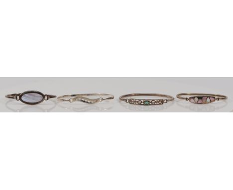 A 925 silver and mother of pearl bangle and three other 925 silver bangles, 35gm (4)