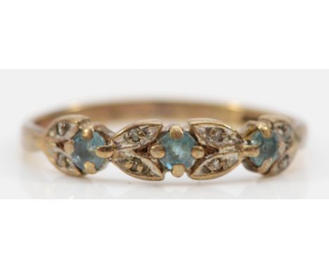 A 9ct gold topaz and diamond floral ring, O 1/2, 1.6g