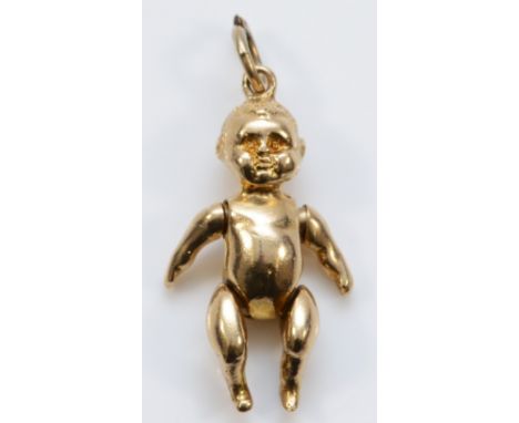 A 9ct gold pendant in the form of an articulated doll, 24mm in length, Birmingham 1991, 5.6g