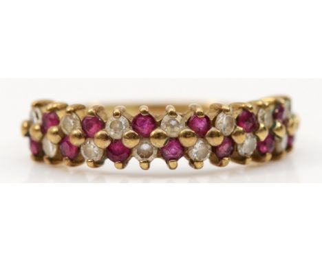 A 9ct gold ruby and cubic zirconia two row half eternity ring, L, 1.7g