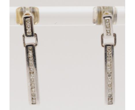 A pair of 9ct white gold diamond bar drop earrings with scroll backs, 23mm drop, 2.3g