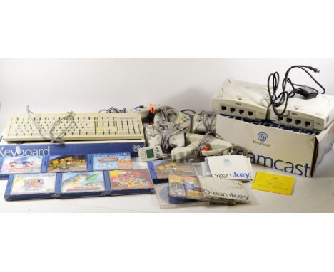 Two Dreamcast consoles, one in the original box, together with three controllers, a MadCatz gun and ten games, to include, To