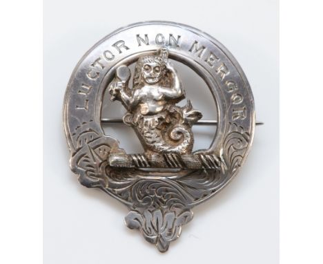 A Scottish Clan brooch for the Glass family, cast mermaid with a comb and brush, with motto 'Luctor, non mergor', by Medlock 