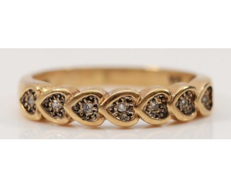 A 9ct gold diamond heart shaped half eternity ring, N, 2.2g