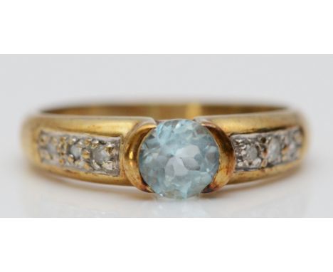 A 9ct gold diamond accented blue topaz dress ring, L, 2.3g