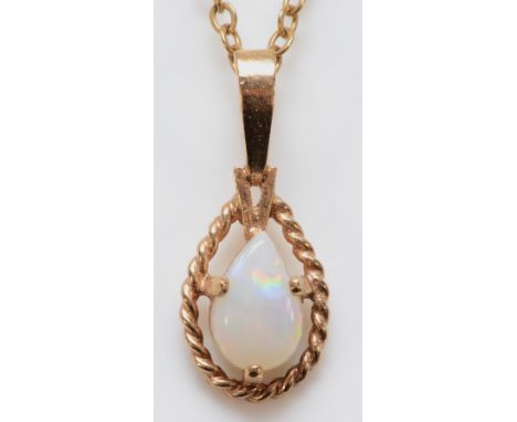 A 9ct gold opal pendant with chain, 1.3g