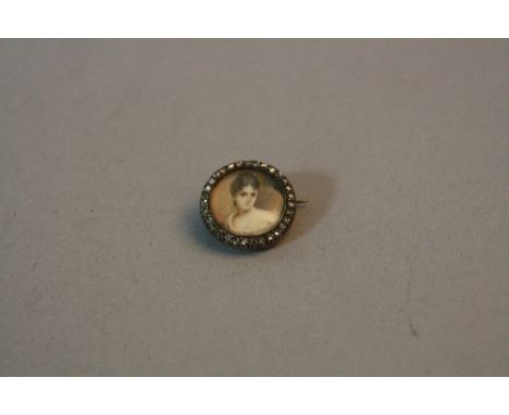 A 19TH CENTURY PORTRAIT MINIATURE BROOCH, depicting a lady in classical dress, rose cut diamond border, measuring approximate