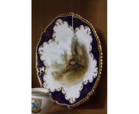 A ROYAL WORCESTER CABINET PLATE, painted with Cock and Hen Pheasants, signed James Stinton, green backstamp blurred