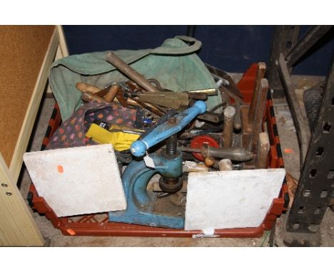 A PLASTIC CRATE CONTAINING VARIOUS VINTAGE HAND TOOLS, bench punch, etc