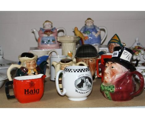 SEVEN NOVELTY TEAPOTS AND EIGHT VARIOUS JUGS, to include Tony Wood 'Mad Hatter', advertising jugs 'Scotch Whisky Black & Whit