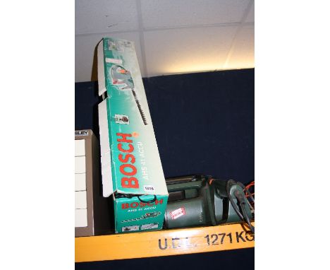 A BOSCH BATTERY HEDGE TRIMMER and a Black and Decker electric chainsaw (2)