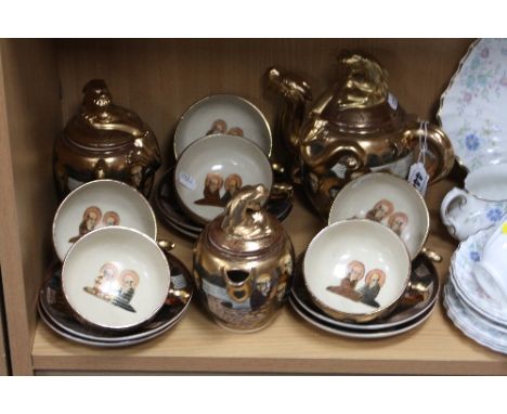 A SATSUMA TEASET, comprising teapot, covered milk jug, covered sugar bowl, six cups and six saucers (slight rubbing)