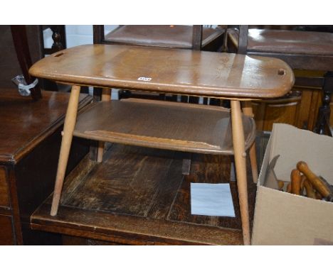 AN ERCOL ELM AND BEECH RECTANGULAR COFFEE TABLE, united by a lower shelf, approximate size width 73cm x depth 44.5cm x height