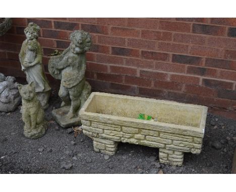 A PRE CAST RECTANGULAR PLANTER, and three composite garden figures (4)