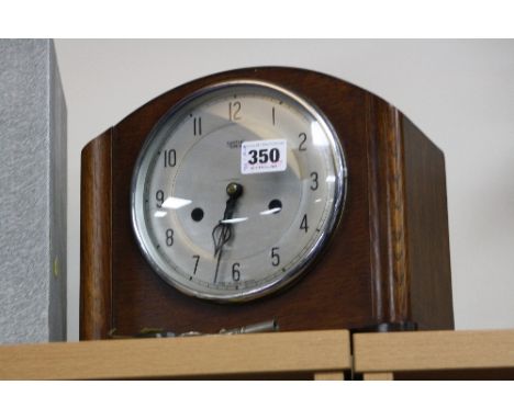 A SMITHS ENFIELD MANTEL CLOCK, (key and pendulum)