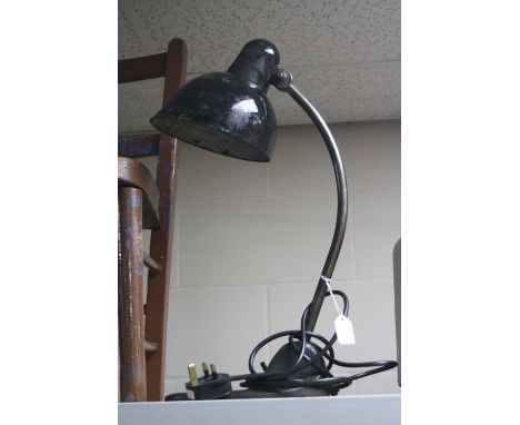 A BLACK PAINTED VINTAGE DESK LAMP, with adjustable shade and support cast base (please note item re-wired and tested as worki