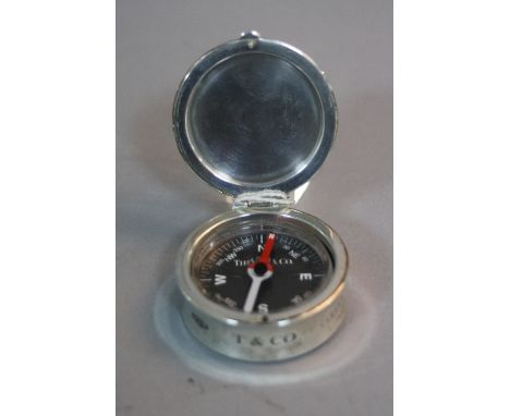 A COMPASS IN A SILVER CASE, by Tiffany inscribed '2001 Tiffany & Co Spain 925'