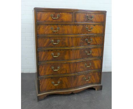 A reproduction mahogany serpentine chest with two short and five graduating long drawers,on bracket feet, 110 x 90 x 50cm 