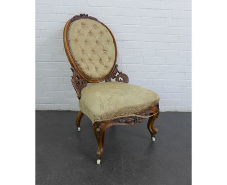 Victorian mahogany framed chair with upholstered button back and seat, on brass caps and ceramic castors, 98 x 55cm 