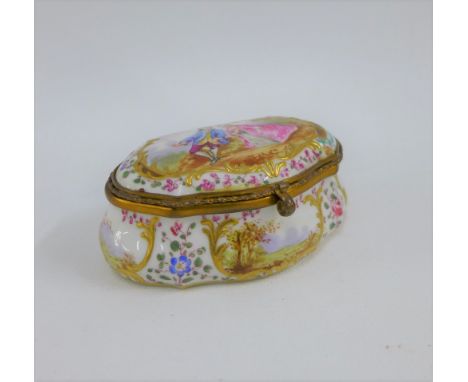 A Continental porcelain snuff / patch box and cover with gilt metal mounts, 9 x 4.5cm 