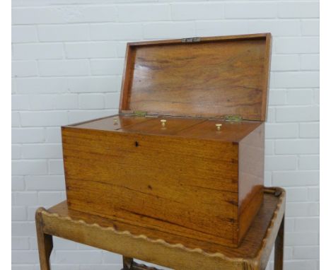A large mahogany caddy box, the hinged lid opening to reveal three divisions, 51 x 28 x 26cm