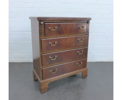 A mahogany chest with a fold over top over pull slides, above four graduating long drawers, on bracket feet, 78 x 62 x 34cm 