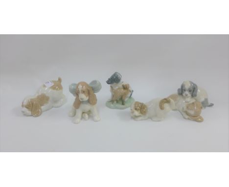 A collection of five Nao dog figures (5) 
