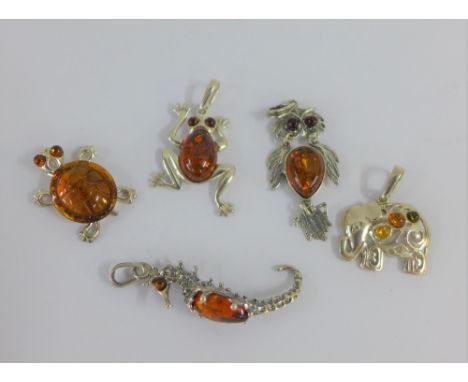 Five various silver and amber pendants (5) 