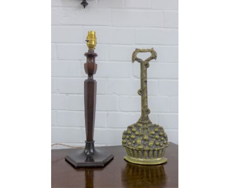 A mahogany table lamp base and a brass 'basket of fruit'  door stop, 35cm high (2) 