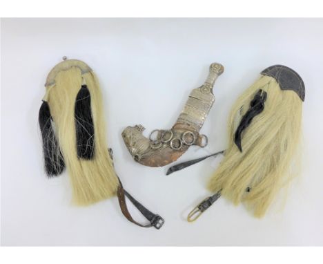 Two boys sporran's and an Eastern dagger (blade rusted) in a leather sheaf with white metal mounts (3) 