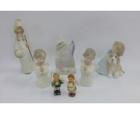 A collection of boxed figures to include Lladro, Nao and Hummel and a Lladro collectors society plaque (7) 