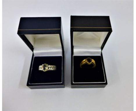 9 carat gold gemset dress ring together with a silver and yellow beryl set dress ring (2) 