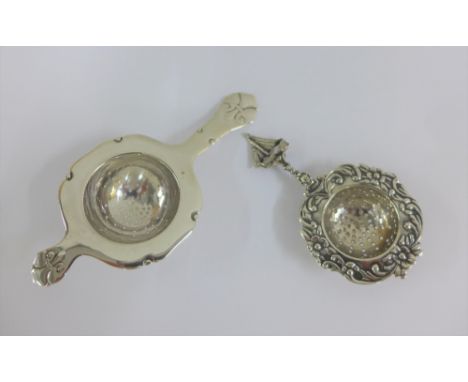 Danish silver strainer with assayers mark Christian F Heise together with a Continental white metal strainer (2) 