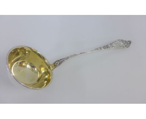 Early 20th century Continental silver gilt ladle, stamped 830S, 31cm long 