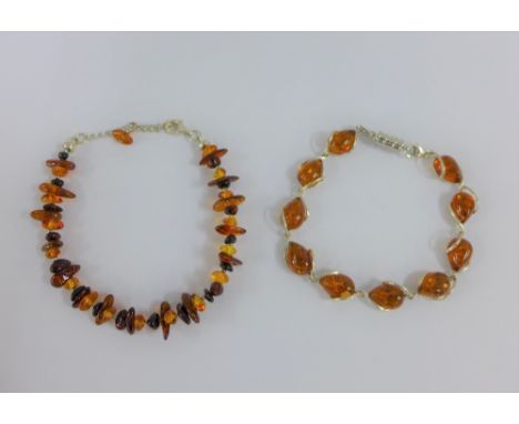 Two silver and amber bracelets (2) 