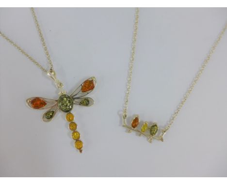 Two silver and amber pendant necklaces (2) 