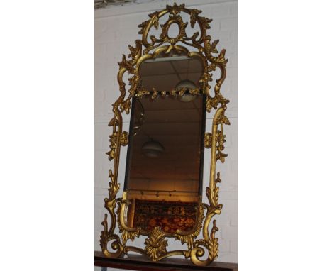 WALL MIRRORS, a pair, Chippendale style gilt framed with scroll, leaf and flowerhead decoration, 70cm W x 154cm H. (2)