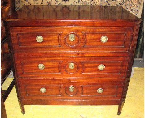 COMMODE, late 18th century Continental mahogany with three drawers with decorative detail and fluted canted corners and panel
