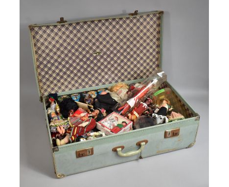 A Vintage Blue Leather Suitcase containing Various Vintage Souvenir Dolls Etc 