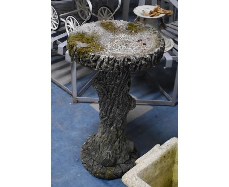 A Reconstituted Stone Garden Bird Bath, The Support in the Form of a tree Trunk, 41cms Diameter and 71cms High 