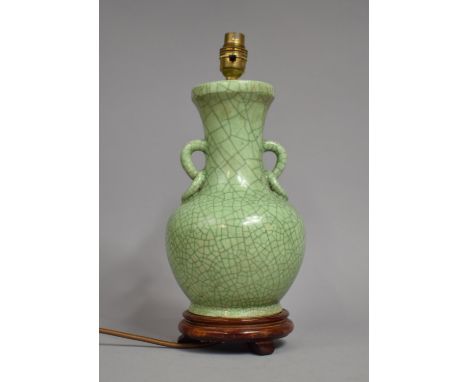 A Modern Chinese Crackle Celadon Glazed Table Lamp of Vase Form with Stylised Twin Handles, On Wooden Stand, 30cm high 