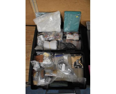 A Toolbox Containing Various Electrical Components and Boards, Pliers Etc 